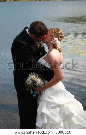 Bride and groom sharing a loving kiss after the ceremony