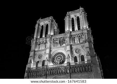Notre Dame de Paris Cathedral at night in black and white.