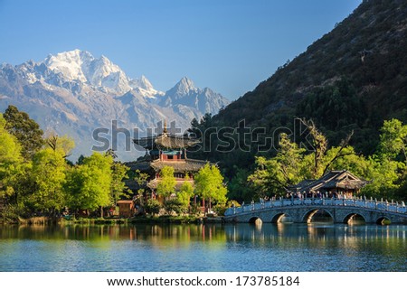 Lijiang old town scene-Black Dragon Pool Park. you can see Jade Dragon Snow Mountain in the background.