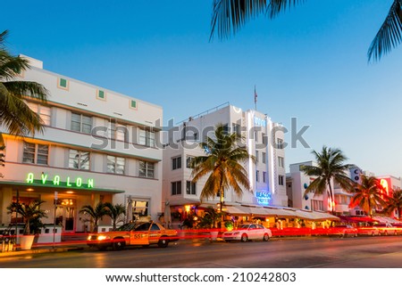 MIAMI - August 10 : Miami Beach, Florida hotels and restaurants at sunset on Ocean Drive on August 10, 2014. World famous destination for it\'s nightlife, beautiful weather and pristine beaches