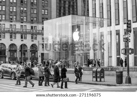 NEW YORK CITY - FEB 13: Shopping street at 5th Avenue in NYC with tourists on  February 13, 2015. It is considered among the most expensive and best shopping streets in the world.