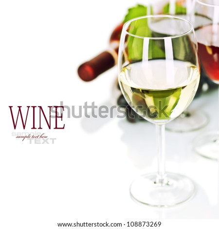 Glasses of white, red and rose wine and grapes over white  (easy removable sample text)