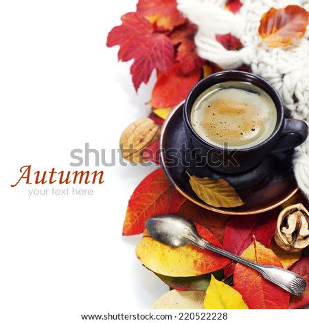 cozy cup of coffee and autumn leaves over white (with easy removable sample text)