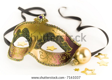 Carnival mask and Christmas decorations on white background
