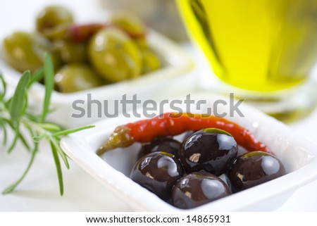 Green and black olives and Bottle of pure fresh olive oil