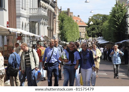 DORDRECHT, NETHERLANDS - JULY 3: People visiting the second hand book market Sunday July 3, 2011 in Dordrecht. 16th Dordtse book market with 300 booksellers and 600 stalls has yearly 75000 visitors.