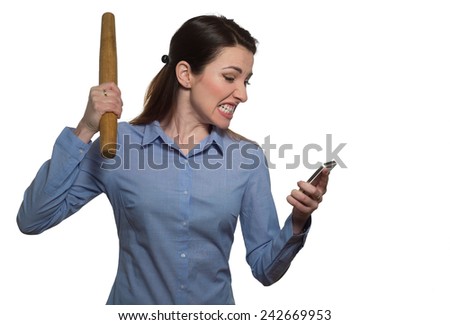 Angry woman screaming and threatens with rolling-pin holding a phone isolated on white background