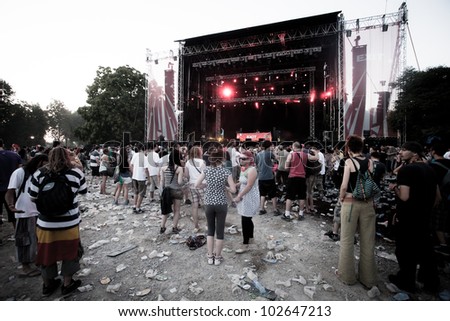 NOVI SAD, SERBIA - JULY 8: People infront of the Main Stage at EXIT 2011 Festival, during Magnetic Man\'s performance in the early morning hours on July 8, 2011 in the Petrovaradin Fortress