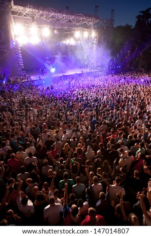 NOVI SAD, SERBIA - JULY 13: Crowd in front of the Dance Arena at EXIT 2013 Music Festival, during Steve Angelo's performance on July 13, 2013 in the Petrovaradin Fortress in Novi Sad.