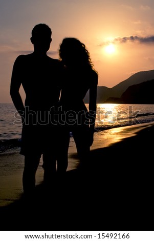 silhouette of a couple in love, on a beach