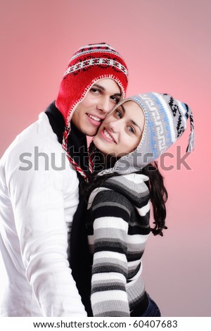 attractive young winter couple having some fun