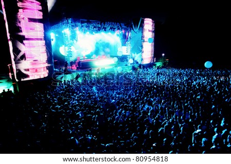 NOVI SAD, SERBIA - JULY 7: Audience in front of the Dance Arena at EXIT 2011 Music Festival, during DEADMAUS5 performance, on July 7, 2011 in the Petrovaradin Fortress in Novi Sad.