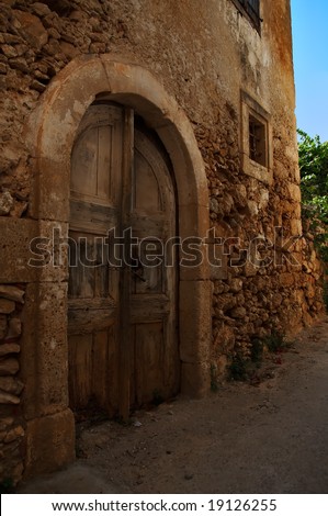 old door in old building in Venetian style in Maroulas Crete