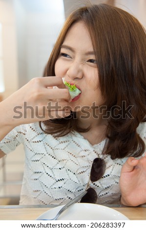 young woman eating vietnam food
