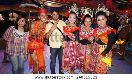 KUALA LUMPUR, MALAYSIA-MAY 25:Tourist and unidentified Malaysians dancer during the Festival Colours of 1 Malaysia May 25, 2013 in Kuala Lumpur Malaysia. 25.72million tourist visited Malaysia in 2013.