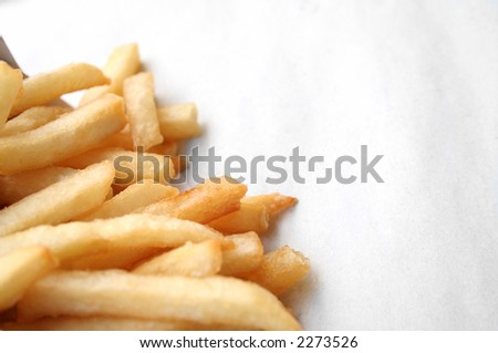 border made from french fries on paper back ground