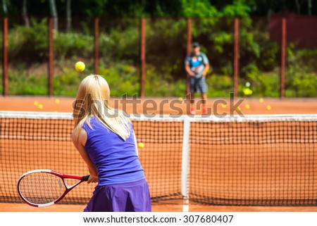 Woman playing tennis and preparing for sports competition. Professional athlete in a form proves the equality of women over men.