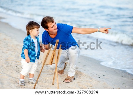Man show in the distance to boy and ask what does he going to draw