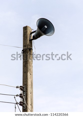 Old megaphone on the pole of rural village.