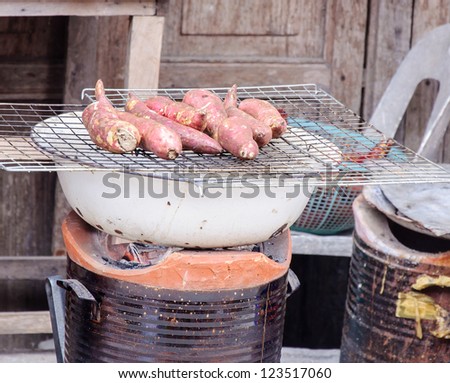 Yam  grilled on the small stove in rural of Thailand.