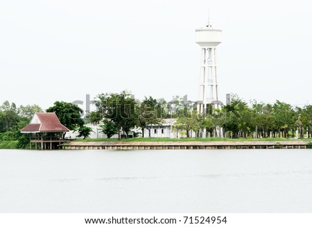 White tower to store water which is located along the lake