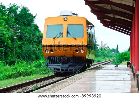 Maintenance train running pass the small station in the southern line of Thailand.
