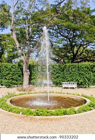 Small fountain in the European style garden of Thai palace.
