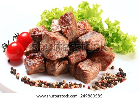 Beef stir fry with green salad isolated on white background