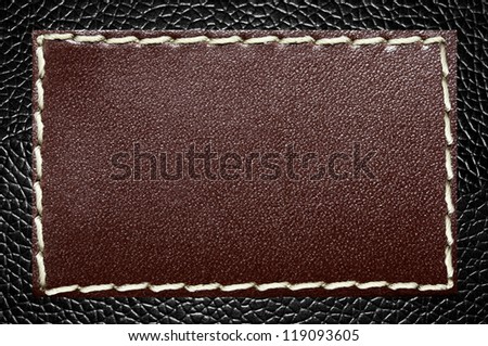 Leather Label on a Black Skin Texture