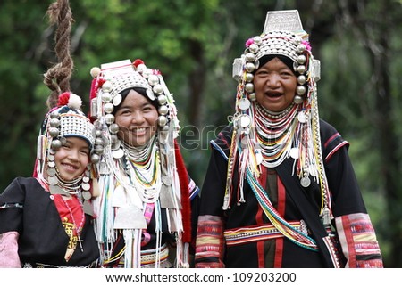 CHIANG RAI, THAILAND - OCT 1 : Akha family with traditional clothes and silver jewelery in akha hitt tribe minority village on October 1, 2011 in Chiang Rai, Thailand.