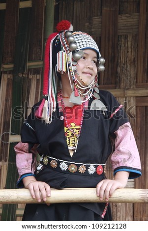 CHIANG RAI, THAILAND - OCT 1 : Akha girl with traditional clothes and silver jewelery in akha hitt tribe minority village on October 1, 2011 in Chiang Rai, Thailand.