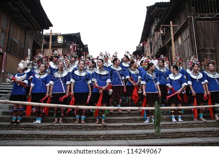 GUANGXI - SEPTEMBER 17: Dong ethnic minority people with traditional dress sing a song called \