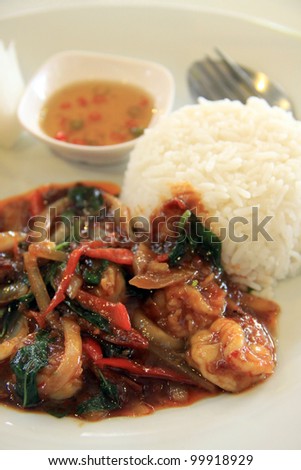 Thai food. rice and shrimp with sweet and spicy sauce, stir and serve with rice. Shallow depth of field.