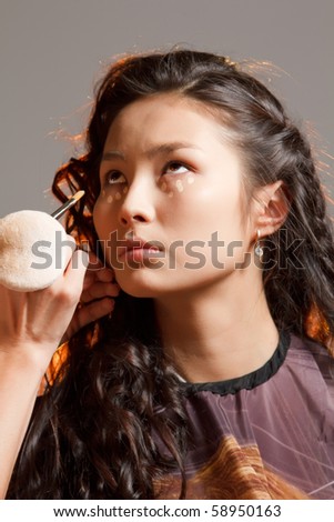 Asian woman in a beauty salon.