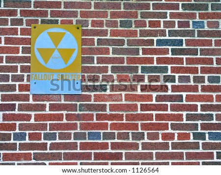 Fallout shelter sign on brick wall