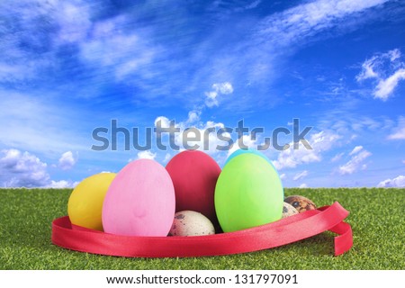 Ester egg on grass over white background