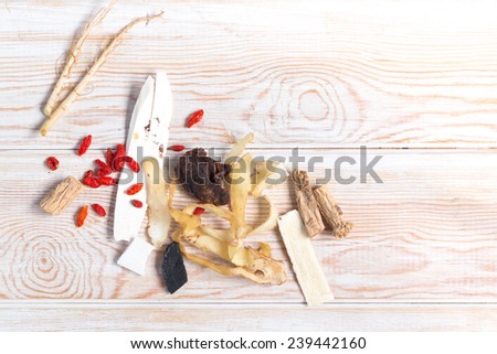 Ingredients for Chinese herbal soup on wood table