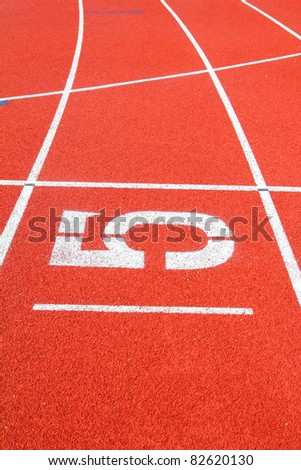 Number 5 on the start of a running track