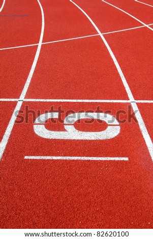 Number 6 on the start of a running track