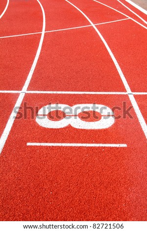 Number 8 on the start of a running track