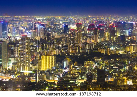 TOKYO, JAPAN - OCTOBER 26: Tokyo cityscape scene night time from sky  view of the Roppongi Hills Building on Oct 26, 2013. Roppongi is a district of Minato, Tokyo, Japan.