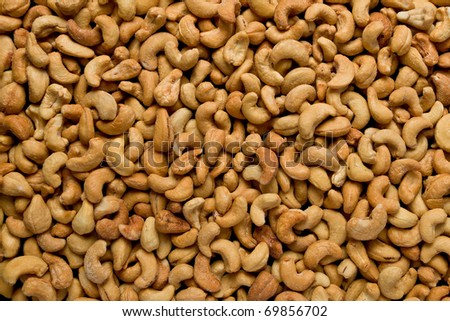 Full frame of salted cashew nuts.