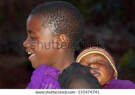 POMERINI VILLAGE, TANZANIA - CIRCA AUGUST 2013:The Franciscan Mission for Humanitarian Aid - The look on the faces of the children of Africa, many of them sick with AIDS, a look for the future