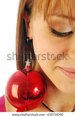 A young woman decked out for Christmas with a ball instead earring
