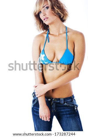 Sexy girl wearing bikini top and jeans