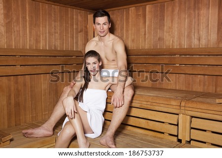 Young couple in sauna relaxing