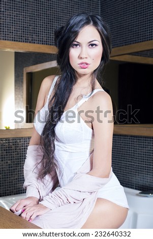 Portrait of a sexy young woman in hotel room