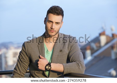 Handsome young male model posing outdoor