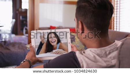 Similar – Image, Stock Photo Happy couple having video conversation on laptop at home