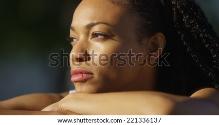 Black woman crying outdoors